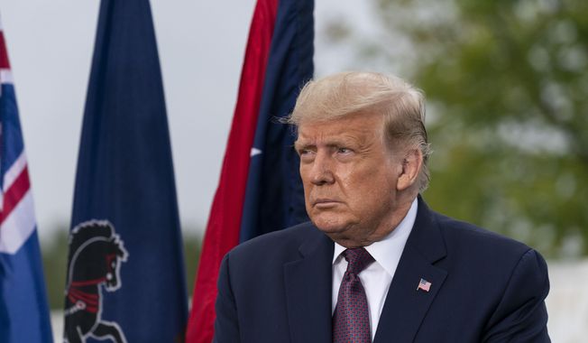 In this file photo, President Donald Trump is seated before speaking at a 19th anniversary observance of the Sept. 11 terror attacks, at the Flight 93 National Memorial in Shanksville, Pa., Friday, Sept. 11, 2020. (AP Photo/Alex Brandon)