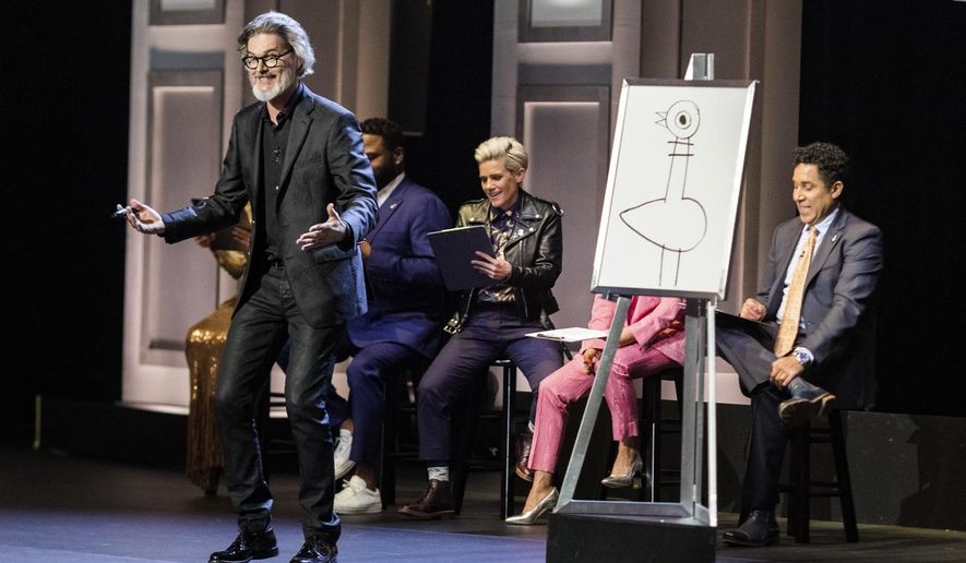 This image released by HBO Max shows author and illustrator Mo Willems, standing, in “Don’t Let the Pigeon Do Storytime!” The special was filmed last year at the Kennedy Center and features comedy inspired by Willems’ books for children. (HBO Max via AP)