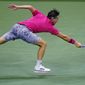 Dominic Thiem, of Austria, stretches for a return against Alex de Minaur, of Australia, during the quarterfinal round of the US Open tennis championships, Wednesday, Sept. 9, 2020, in New York. (AP Photo/Frank Franklin II)