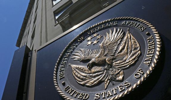 This June 21, 2013, photo, shows the seal affixed to the front of the Department of Veterans Affairs building in Washington. (AP Photo/Charles Dharapak) **FILE**