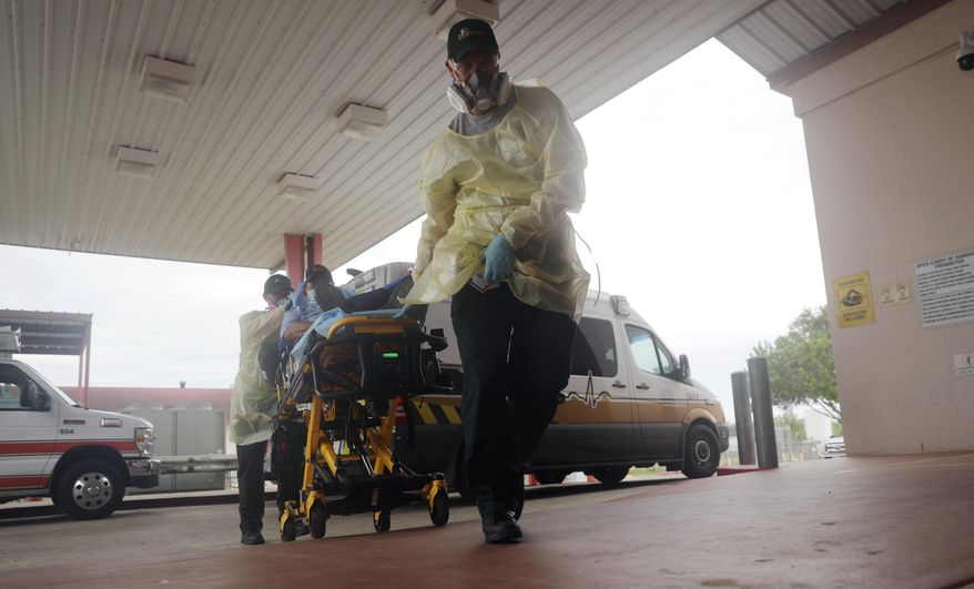 FILE - In this July 28, 2020, file photo, a man arrives at Starr County Memorial Hospital in Rio Grande City, Texas. The number of daily U.S. deaths from the coronavirus is declining again after peaking in early August, but scientists are warning that a new bout with the disease this fall could claim more lives. (AP Photo/Eric Gay, File)