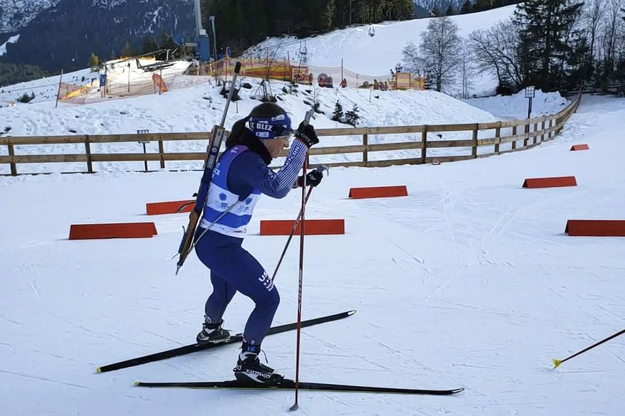 Associated Press reporter Martha Bellisle skis up to the shooting range during the individual Biathalon race during the Winter World Masters Games in Seefeld, Austria on Jan. 14, 2020. (Courtesy of Martha Bellisle via AP)