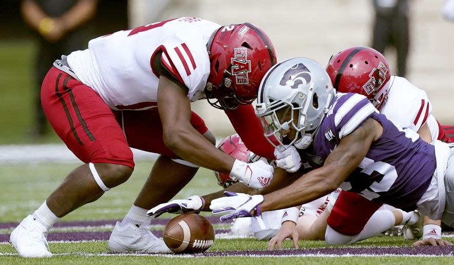 Kansas State defensive back D.J. Render (23) recovers an on-side kick during the first half of an NCAA college football game against Arkansas State Saturday, Sept. 12, 2020, in Manhattan, Kan. (AP Photo/Charlie Riedel)