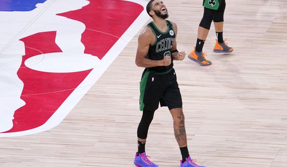Boston Celtics&#39; Jayson Tatum (0) reacts after his team defeated the Toronto Raptors during an NBA conference semifinal playoff basketball game Friday, Sept. 11, 2020, in Lake Buena Vista, Fla. The Celtics won 92-87. (AP Photo/Mark J. Terrill)