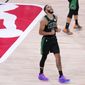 Boston Celtics&#39; Jayson Tatum (0) reacts after his team defeated the Toronto Raptors during an NBA conference semifinal playoff basketball game Friday, Sept. 11, 2020, in Lake Buena Vista, Fla. The Celtics won 92-87. (AP Photo/Mark J. Terrill)