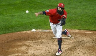 Minnesota Twins pitcher Sergio Romo throws to a Cleveland Indians batter during the eighth inning of a baseball game Friday, Sept. 11, 2020, in Minneapolis. The Twins won 3-1. (AP Photo/Craig Lassig)