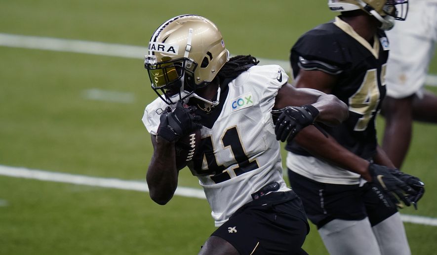 New Orleans Saints running back Alvin Kamara (41) runs through drills during NFL football practice in New Orleans, Thursday, Sept. 3, 2020. (AP Photo/Gerald Herbert, Pool)