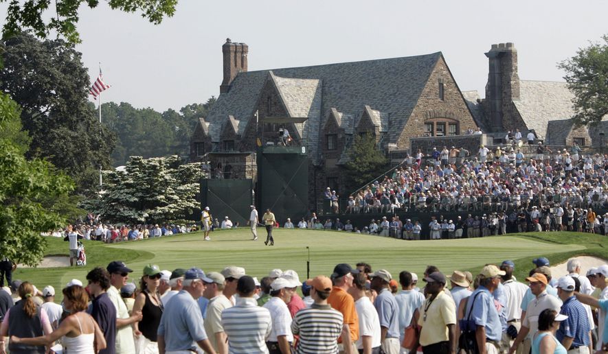 FILE - In this June 18, 2006, file photo, Phil Mickelson and Kenneth Ferrie are shown on the ninth green during the final round of the U.S. Open golf tournament at Winged Foot Golf Club in Mamaroneck, N.Y. The U.S. Open returns to Winged Foot next week, held in September because for the first time since 1913. (AP Photo/Morry Gash, File)