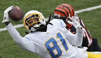 Los Angeles Chargers&#39; Mike Williams (81) tries to make a catch against Cincinnati Bengals&#39; William Jackson (22) during the first half of an NFL football game, Sunday, Sept. 13, 2020, in Cincinnati. The pass was incomplete. (AP Photo/Darron Cummings)