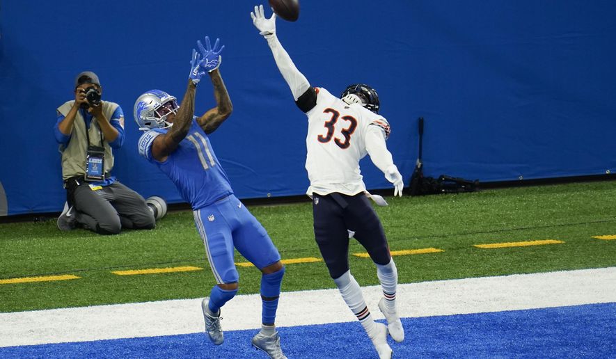 Chicago Bears cornerback Jaylon Johnson (33) breaks up a pass intended for Detroit Lions wide receiver Marvin Jones (11) in the end zone in the fourth quarter of an NFL football game in Detroit, Sunday, Sept. 13, 2020. Chicago won 27-23. (AP Photo/Paul Sancya)