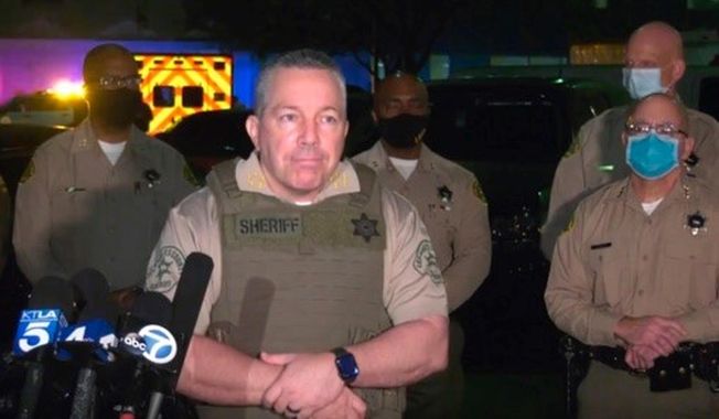 This Saturday, Sept. 12, 2020, still image taken from video released by the Los Angeles County Sheriff&#x27;s Department, shows Los Angeles Sheriff Alex Villanueva taking questions at a late-night news conference about the condition of two Sheriff&#x27;s deputies in Compton, Calif. Authorities searched Sunday for a gunman who shot and wounded two Los Angeles County sheriff&#x27;s deputies who were sitting in their squad car, an apparent ambush that drew an angry response from the president and sparked an anti-police protest outside the hospital where the deputies were being treated. (Los Angeles County Sheriff&#x27;s Department via AP)
