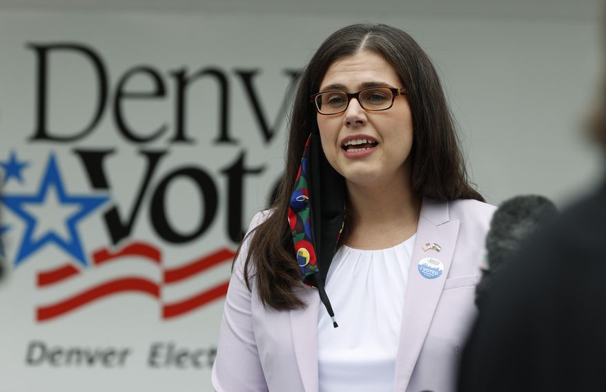 Colorado Secretary of State Jena Griswold makes a point during a news conference at a mobile voting location in the Swansea neighborhood, Tuesday, June 30, 2020, in Denver. (AP Photo/David Zalubowski)
