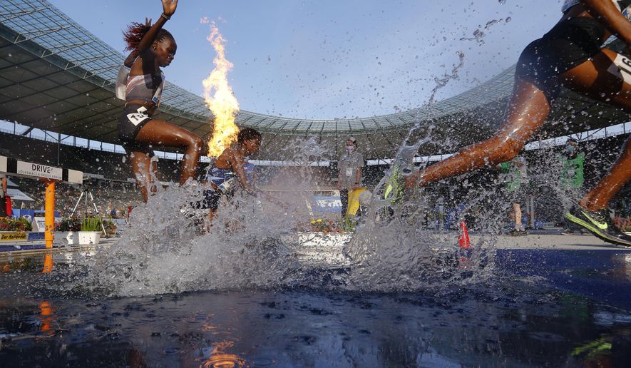 Kenya&#39;s Hyvin Kiyeng, left, competes during the women&#39;s 3,000 meters steeplechase at the ISTAF Athletics Meeting in Berlin, Germany, Sunday, Sept. 13, 2020. (AP Photo/Markus Schreiber)