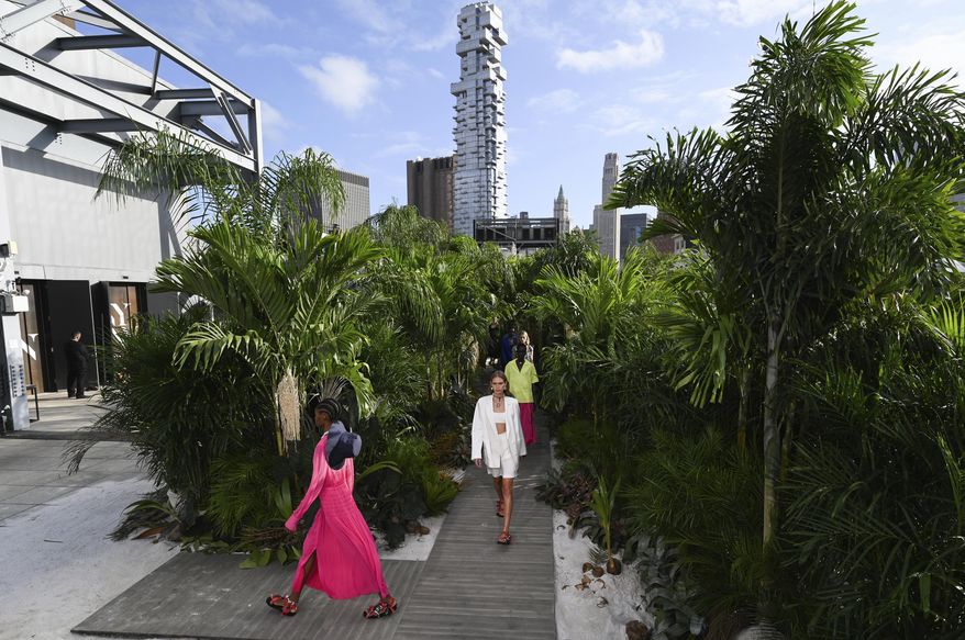 Models walk the runway during the Jason Wu Spring/Summer 2021 fashion show at Spring Studios during New York Fashion Week, Sunday, Sept. 13, 2020, in New York. (Photo by Evan Agostini/Invision/AP)