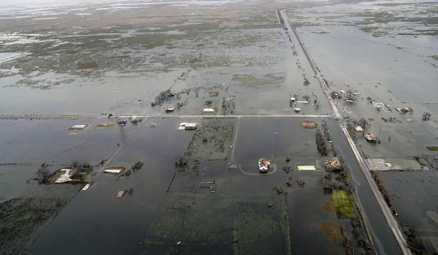 State Highway 27 leading to Cameron, La. is seen in Creole, La., Friday, Aug. 28 2020, as the storm surge recedes in the aftermath of Hurricane Laura. (AP Photo/Gerald Herbert)
