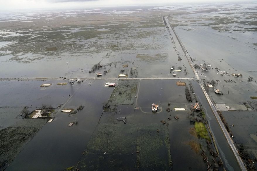 State Highway 27 leading to Cameron, La. is seen in Creole, La., Friday, Aug. 28 2020, as the storm surge recedes in the aftermath of Hurricane Laura. (AP Photo/Gerald Herbert)