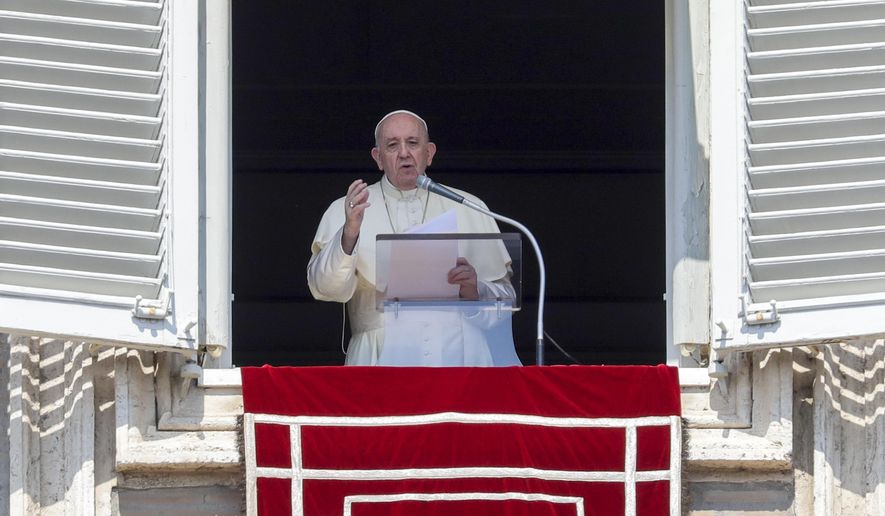 Pope Francis delivers his blessing as he recites the Angelus noon prayer from the window of his studio overlooking St.Peter&#39;s Square, at the Vatican, Sunday, Sept. 13, 2020. (AP Photo/Andrew Medichini)