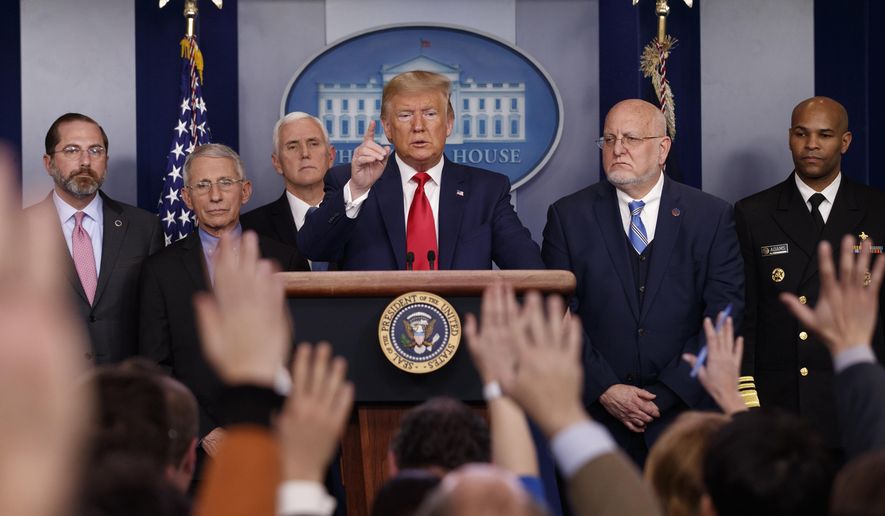 FILE - In this Feb. 29, 2020, file photo President Donald Trump, center, points as he prepares to answer question after speaking about the coronavirus in the press briefing room at the White House in Washington, as Health and Human Services Secretary Alex Azar, National Institute for Allergy and Infectious Diseases Director Dr. Anthony Fauci, Vice President Mike Pence, Robert Redfield, director of the Centers for Disease Control and Prevention and U.S. Surgeon General Dr. Jerome Adams listen. Public health officials were already warning Americans about the need to prepare for the coronavirus threat in early February when President Donald Trump called it “deadly stuff” in a private conversation that has only now has come to light. (AP Photo/Carolyn Kaster, File)