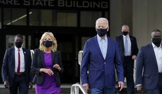Democratic presidential candidate and former Vice President Joe Biden and his wife Jill Biden depart after voting early in Delaware&#39;s state primary election at the New Castle County Board of Elections office in Wilmington, Del., Monday, Sept. 14, 2020. (AP Photo/Patrick Semansky)
