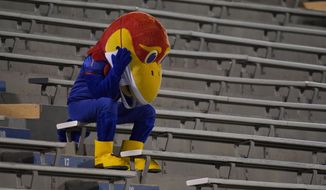 Kansas Jayhawk mascot sits in the empty stands during the second half of an NCAA college football game against Coastal Carolina in Lawrence, Kan., Saturday, Sept. 12, 2020. Coastal Carolina defeated Kansas 38-23. (AP Photo/Orlin Wagner)