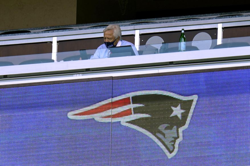 New England Patriots owner Robert Kraft wears a mask as he sits alone in his box in the first half of an NFL football game against the Miami Dolphins during the coronavirus pandemic, Sunday, Sept. 13, 2020, in Foxborough, Mass. (AP Photo/Charles Krupa)
