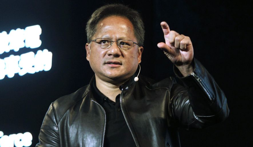 FILE - In this Tuesday, May 30, 2017 file photo, Nvidia CEO Jensen Huang delivers a speech about AI and gaming during the Computex Taipei exhibition at the world trade center in Taipei, Taiwan. Computer graphics chip company Nvidia said it plans to buy Britain&#39;s Arm Holdings for $40 billion, in a merger of two leading chipmakers. Santa Clara, California-based Nvidia and Arm&#39;s parent company, Japanese technology giant SoftBank, announced the deal Sunday, Sept. 13, 2020. (AP Photo/Chiang Ying-ying, File)