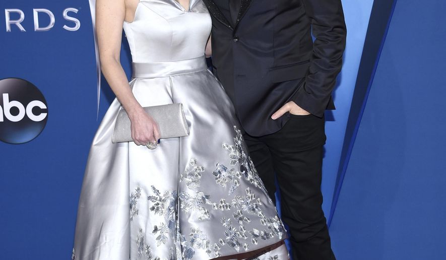 Kimberly Williams-Paisley, left, and Brad Paisley arrive at the 51st annual CMA Awards on Wednesday, Nov. 8, 2017, in Nashville, Tenn. The couple have pledged to donate one million nutritional meals in various cities around the country. The initiative is billed as the Million Meal Donation Tour, which kicked off in Detroit last week. The tour will run for two weeks visiting food banks in 16 major cities.(Photo by Evan Agostini/Invision/AP)