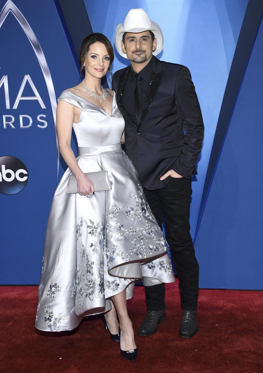 Kimberly Williams-Paisley, left, and Brad Paisley arrive at the 51st annual CMA Awards on Wednesday, Nov. 8, 2017, in Nashville, Tenn. The couple have pledged to donate one million nutritional meals in various cities around the country. The initiative is billed as the Million Meal Donation Tour, which kicked off in Detroit last week. The tour will run for two weeks visiting food banks in 16 major cities.(Photo by Evan Agostini/Invision/AP)