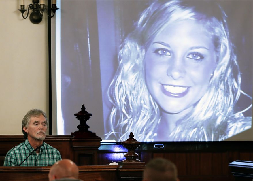 FILE - In this Sept. 11, 2017 file photo, Dana Bobo, let, father of Holly Bobo testifies in the trial of Zachary Adams as a photo of Holly Bobo is displayed in Savannah, Tenn. Jason Autry pleaded guilty Monday, Sept. 14, 2020 to taking part in the killing of Tennessee nursing student Holly Bobo more than nine years ago, but he is expected to be released soon as part of a deal with prosecutors. (AP Photo/Mark Humphrey, Pool, File)