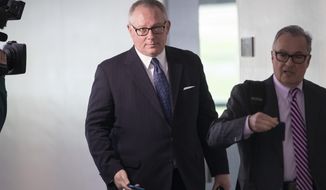 In this May 1, 2018, file photo, former Donald Trump campaign official Michael Caputo, left, joined by his attorney Dennis C. Vacco, leaves after being interviewed by Senate Intelligence Committee staff investigating Russian meddling in the 2016 presidential election, on Capitol Hill in Washington. (AP Photo/J. Scott Applewhite, File)