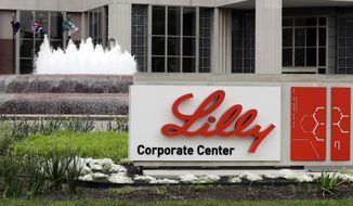 FILE - The Eli Lilly corporate headquarters is pictured April 26, 2017, in Indianapolis. A drug company says that adding an anti-inflammatory medicine to a drug already widely used for hospitalized COVID-19 patients shortens their time to recovery by an additional day. Eli Lilly announced the results Monday, Sept. 14, 2020, from a 1,000-person study sponsored by the U.S. National Institute of Allergy and Infectious Diseases. (AP Photo/Darron Cummings, File)