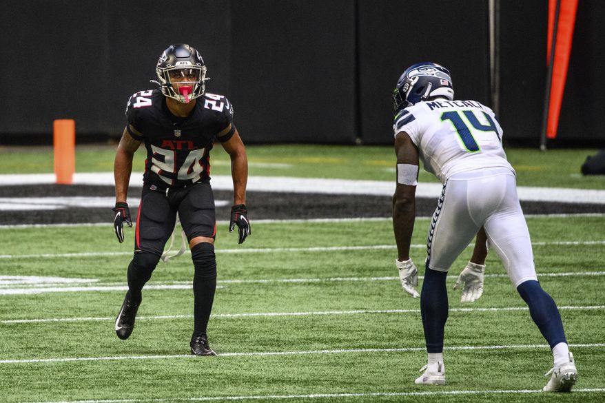 Atlanta Falcons cornerback A.J. Terrell (24) lines up across from Seattle Seahawks wide receiver DK Metcalf (14) during the second half of an NFL football game, Sunday, Sept. 13, 2020, in Atlanta. The Seattle Seahawks won 38-25. (AP Photo/Danny Karnik) **FILE**