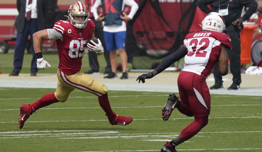 San Francisco 49ers tight end George Kittle (85) runs against Arizona Cardinals strong safety Budda Baker (32) during the first half of an NFL football game in Santa Clara, Calif., Sunday, Sept. 13, 2020. (AP Photo/Tony Avelar)