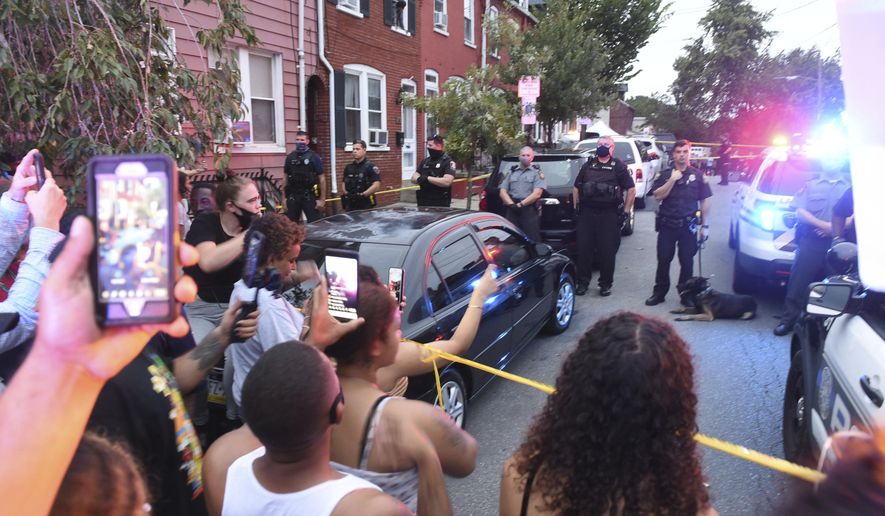 People chant during a protest at the scene of a police shooting on Laurel Street and Union Street in Lancaster city on Sunday, Sept. 13, 2020.A man was shot by police earlier in the day after a reported domestic dispute, police said. A Lancaster city police officer fired at a 27-year-old man who was armed with a knife. The man, identified as Ricardo Munoz, was killed and pronounced dead at the scene,  (Andy Blackburn/LNP/LancasterOnline via AP)