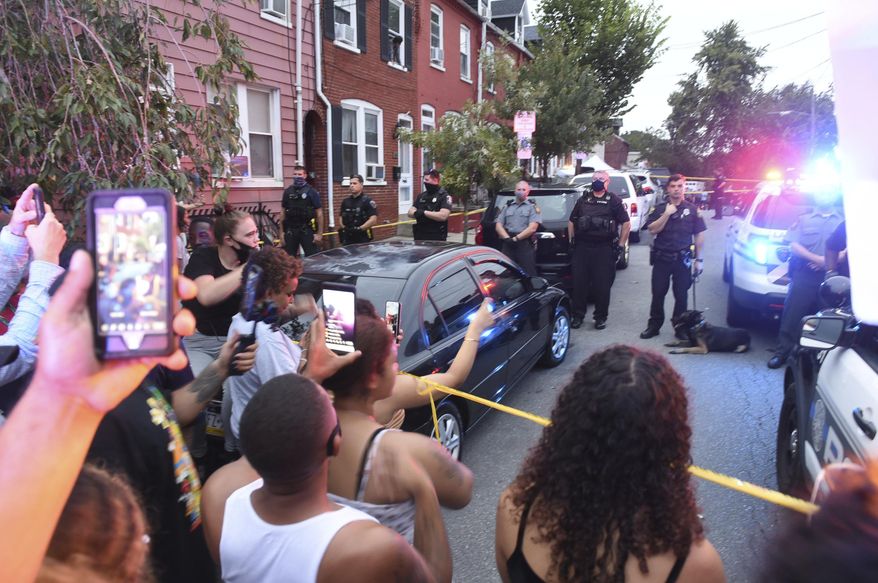 People chant during a protest at the scene of a police shooting on Laurel Street and Union Street in Lancaster city on Sunday, Sept. 13, 2020.A man was shot by police earlier in the day after a reported domestic dispute, police said. A Lancaster city police officer fired at a 27-year-old man who was armed with a knife. The man, identified as Ricardo Munoz, was killed and pronounced dead at the scene,  (Andy Blackburn/LNP/LancasterOnline via AP)