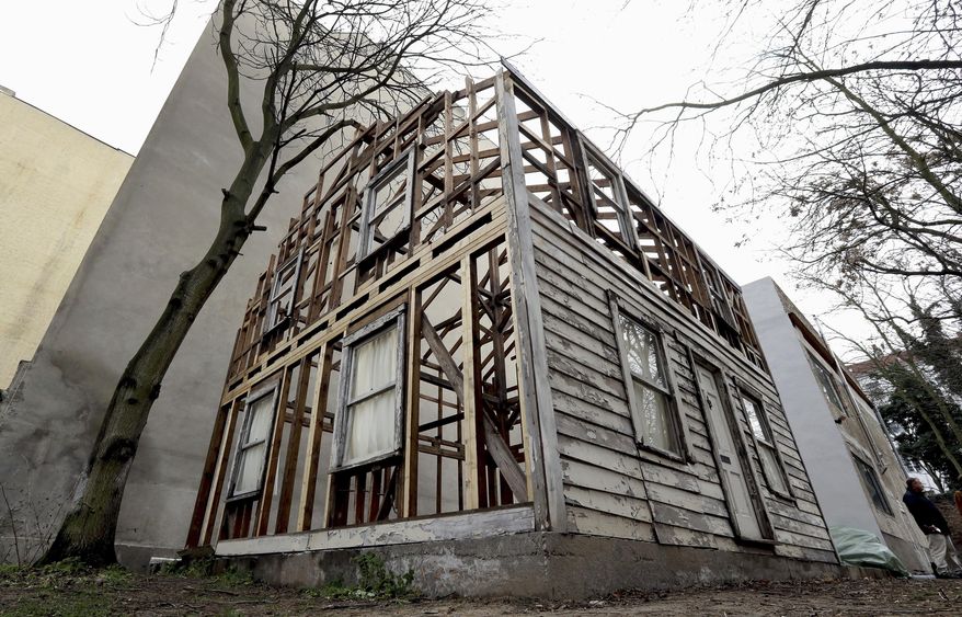 This Dec. 12, 2017, file photo shows the rebuilt house of the civil rights activist Rosa Parks in Berlin, Germany. The rundown, paint-chipped Detroit house where U.S. civil rights campaigner Rosa Parks took refuge after her historic bus boycott is going on display on Tuesday, Sept. 15, 2020, in Italy in a setting that couldn’t be more incongruous: the imposing central courtyard of the 18th century Royal Palace in Naples, southern Italy. (AP Photo/Michael Sohn, file)