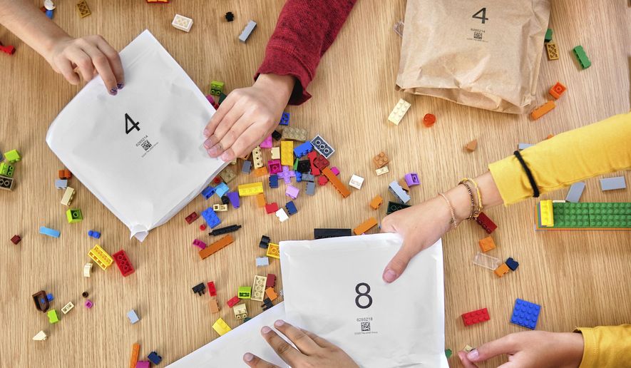 In an image provided by Lego, colorful toy Lego bricks are seen. Lego said Tuesday, Sept. 15, 2020, that it will stop using plastic bags inside its boxed sets and replace them with paper ones. (Allan Ringgaard/Courtesy of Lego via AP)