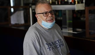 Joe Bastone, owner of Yankee Tavern, responds to questions during an interview Friday, Aug. 14, 2020, in New York. (AP Photo/Frank Franklin II)