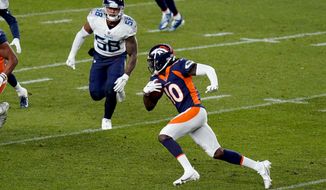 Denver Broncos wide receiver Jerry Jeudy (10) runs the ball as Tennessee Titans linebacker Harold Landry (58) pursues during the first half of an NFL football game, Monday, Sept. 14, 2020, in Denver. (AP Photo/Jack Dempsey)