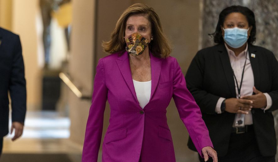 House Speaker Nancy Pelosi of Calif., walks to her office, Monday, Sept. 14, 2020, on Capitol Hill in Washington. (AP Photo/Jacquelyn Martin)