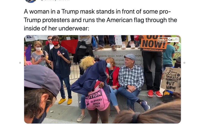An anti-Trump protester in Philadelphia uses the American flag as a form of floss and runs it through her pants, Sept. 15, 2020. (Image: Twitter, Shelby Talcott of The Daily Caller, tweet screenshot) 