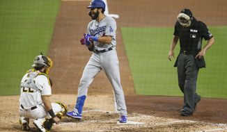Los Angeles Dodgers&#39; Edwin Rios reacts as he crosses home plate after hitting a solo home run against the San Diego Padres starting pitcher Zach Davies in the fifth inning of a baseball game Tuesday, Sept. 15, 2020, in San Diego. (AP Photo/Derrick Tuskan)