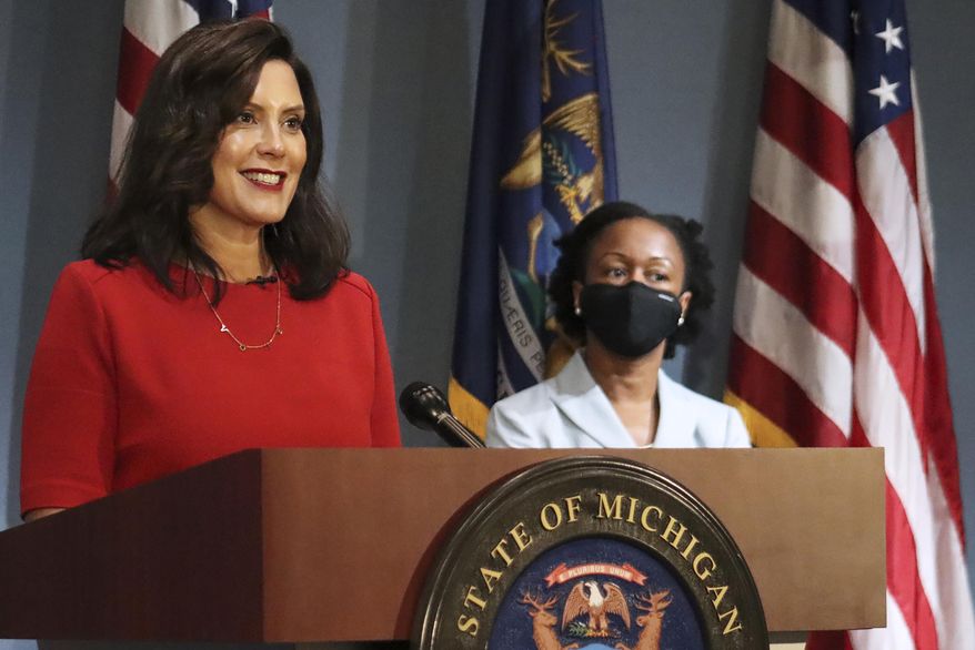 In this photo provided by the Michigan Office of the Governor, Gov. Gretchen Whitmer addresses the state during a speech in Lansing, Mich., Wednesday, Sept. 16, 2020. Whitmer said Wednesday, it practically does not make sense for Michigan to enforce coronavirus restrictions at President Donald Trump's reelection campaign rallies while also pointing to First Amendment freedoms. The Democratic governor has expressed safety concerns with several thousand attending a Trump rally in the Saginaw area last week, calling it a potential COVID-19 superspreader event. (Michigan Office of the Governor via AP)