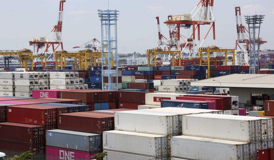 Containers are placed at a port in Yokohama, south of Tokyo, on June 17, 2020. Japan’s trade surplus widened in August as the pandemic pummeled a wide array of industries and sapped consumer demand, according to preliminary data from the Finance Ministry released Wednesday, Sept. 16, 2020. (AP Photo/Koji Sasahara)