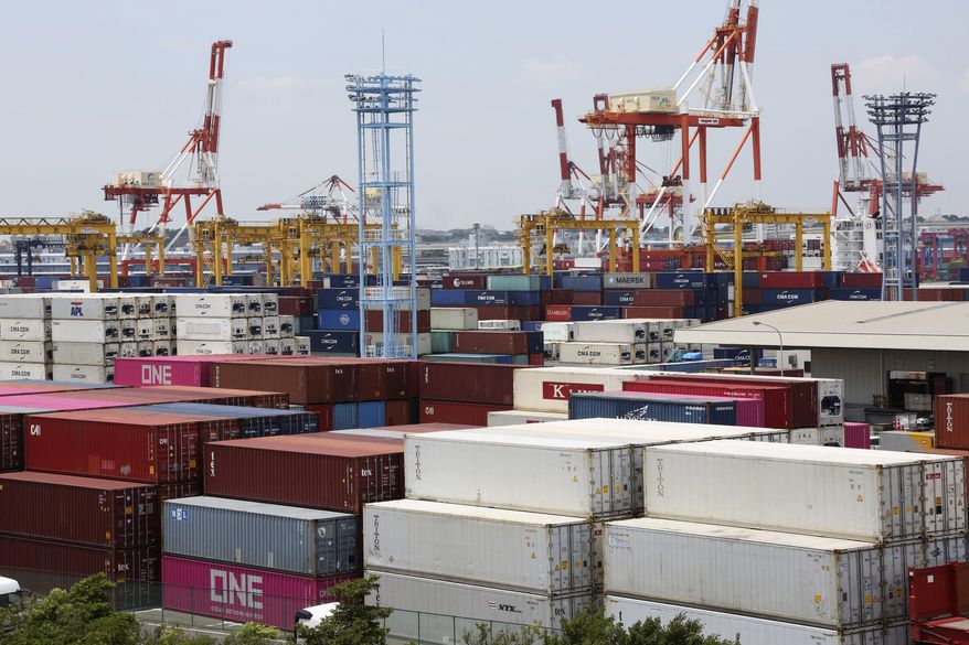 Containers are placed at a port in Yokohama, south of Tokyo, on June 17, 2020. Japan’s trade surplus widened in August as the pandemic pummeled a wide array of industries and sapped consumer demand, according to preliminary data from the Finance Ministry released Wednesday, Sept. 16, 2020. (AP Photo/Koji Sasahara)
