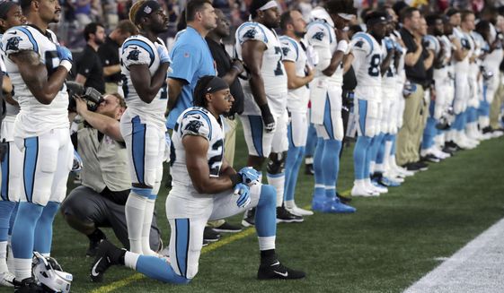 In this Aug. 22, 2019, file photo, Carolina Panthers strong safety Eric Reid (25) kneels during the national anthem before the team&#39;s NFL preseason football game against the New England Patriots in Foxborough, Mass. Despite setting two defensive franchise records for the Panthers last season, Reid remains unsigned like his close friend Colin Kaepernick. Washington coach Ron Rivera, Reid’s former coach in Carolina, gave him a strong endorsement Wednesday, Sept. 16. “I would tell them he’s a heckuva teammate,” Rivera said. &amp;quot;He came in and the young man did exactly what was asked of him.&amp;quot; (AP Photo/Charles Krupa, File)  **FILE**