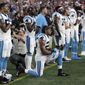 In this Aug. 22, 2019, file photo, Carolina Panthers strong safety Eric Reid (25) kneels during the national anthem before the team&#39;s NFL preseason football game against the New England Patriots in Foxborough, Mass. Despite setting two defensive franchise records for the Panthers last season, Reid remains unsigned like his close friend Colin Kaepernick. Washington coach Ron Rivera, Reid’s former coach in Carolina, gave him a strong endorsement Wednesday, Sept. 16. “I would tell them he’s a heckuva teammate,” Rivera said. &amp;quot;He came in and the young man did exactly what was asked of him.&amp;quot; (AP Photo/Charles Krupa, File)  **FILE**