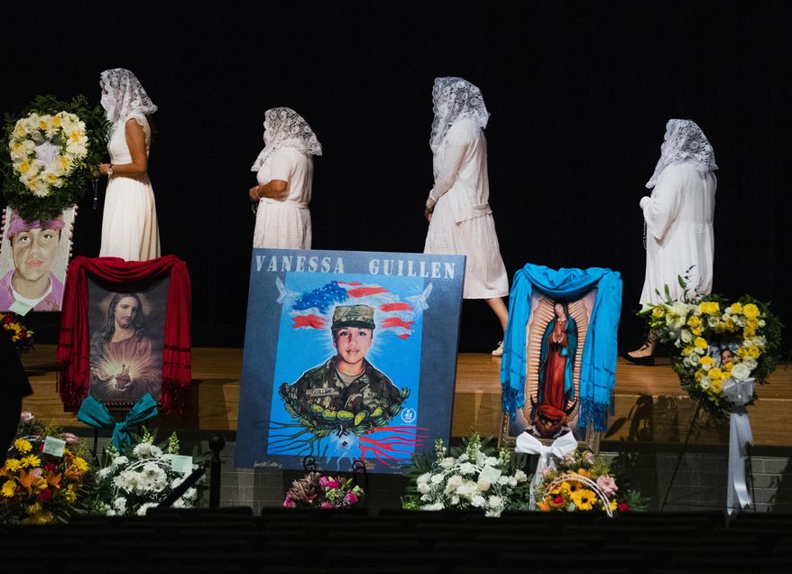 Ladies from the Queen of Peace Church walk to the stage to pray the rosary during the memorial service of U.S. Army Specialist Vanessa Guillen at the Cesar Chavez High School on Friday, Aug. 14, 2020, in Houston. (Marie D. De Jesus/Houston Chronicle via AP, Pool)