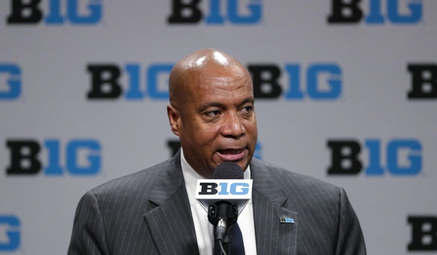 FILE - In this March 12, 2020, file photo, Big Ten Commissioner Kevin Warren addresses the media in Indianapolis. The Big Ten’s plan to play football this fall includes trying to save lives in the future. The conference announced Wednesday, Sept. 16, 2020, it would have a football season this fall. The Big Ten is setting up a cardiac registry to study the effects COVID-19 has on student-athletes' hearts. Big Ten Commissioner Kevin Warren said it will help all students, surrounding communities, and the entire nation. (AP Photo/Michael Conroy, File)