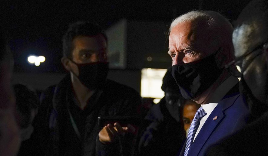 Democratic presidential candidate former Vice President Joe Biden talks with reporters at Wilkes-Barre Scranton International Airport, in Avoca, Pa., after a CNN town hall Thursday, Sept. 17, 2020. (AP Photo/Carolyn Kaster)